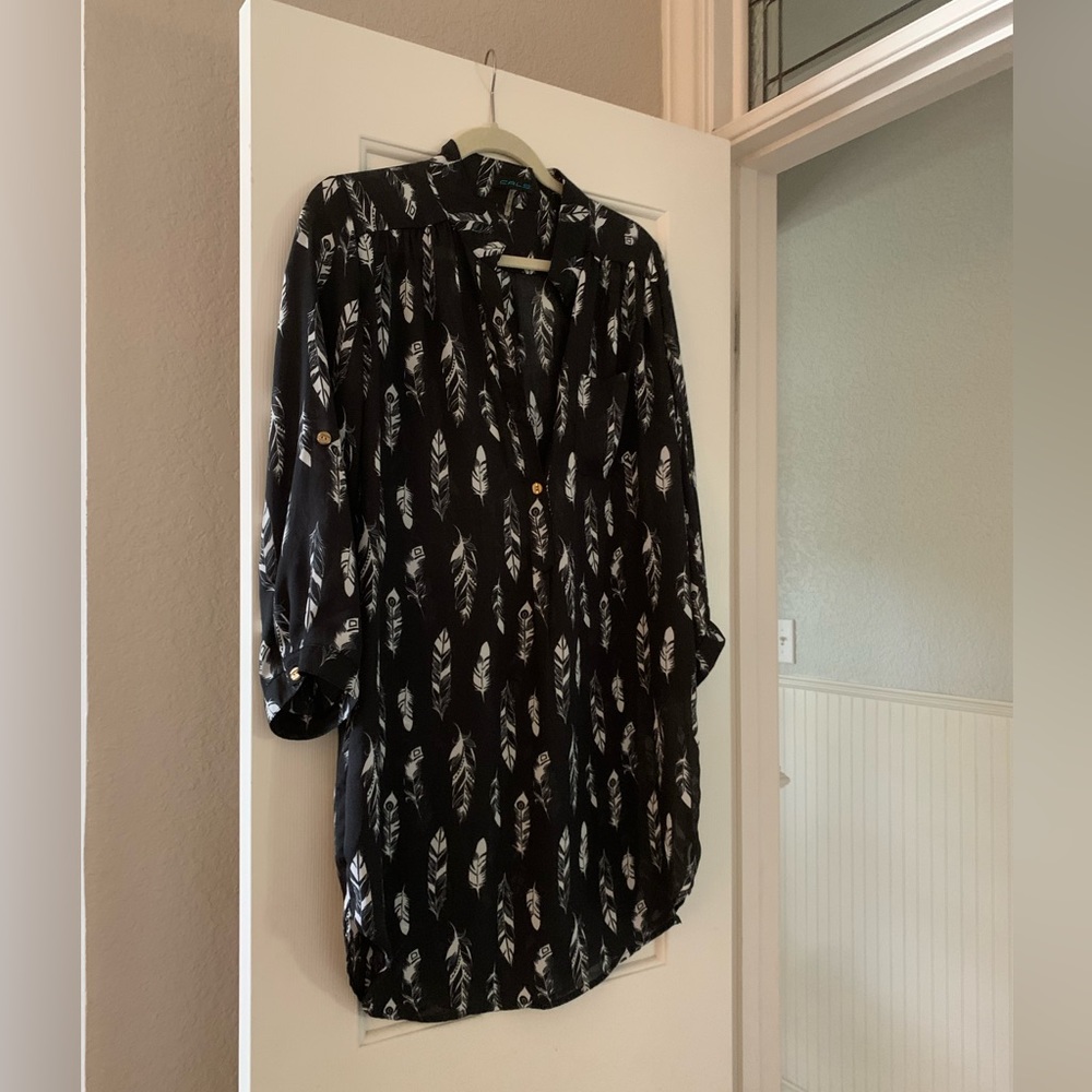 Black dress/long shirt with feathers on it
